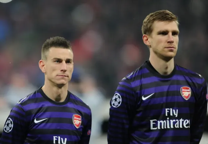 Framed Print : Laurent Koscielny and Per Mertesacker (Arsenal). Bayern Munich 0: 2 Arsenal. UEFA Champions League