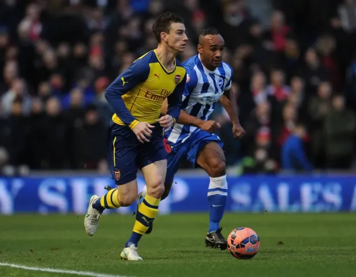 Framed Print : Laurent Koscielny Outmuscles Chris O'Grady in FA Cup Clash: Brighton vs Arsenal Framed Print : Laurent Koscielny Outmuscles Chris O'Grady in FA Cup Clash: Brighton vs Arsenal