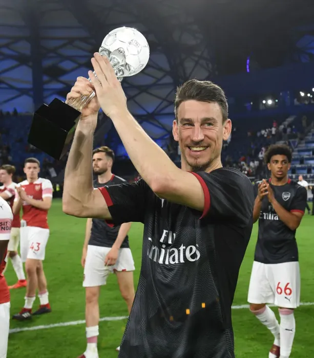 Framed Print : Laurent Koscielny: Reflective Moment after Arsenal's Match at Al-Nasr Dubai SC, 2019
