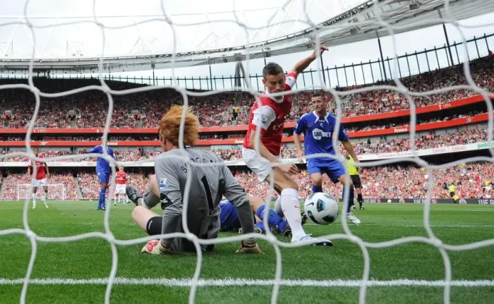 Framed Print : Laurent Koscielny shoots past Bolton goalkeeper Adam Bogdan to score the 1st Arsenal goal Framed Print : Laurent Koscielny shoots past Bolton goalkeeper Adam Bogdan to score the 1st Arsenal goal