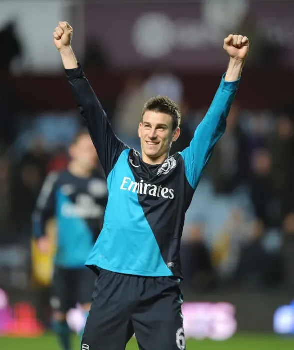 Framed Print : Laurent Koscielny's Celebration: Arsenal's Victory over Aston Villa (2011-12) Framed Print : Laurent Koscielny's Celebration: Arsenal's Victory over Aston Villa (2011-12)