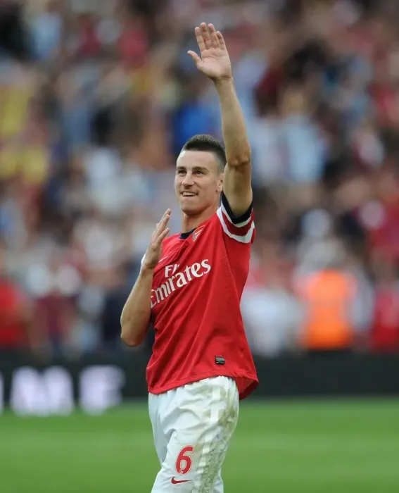 Framed Print : Laurent Koscielny's Emotional Victory Celebration: Arsenal's Triumph Over Tottenham Hotspur (2013-14)