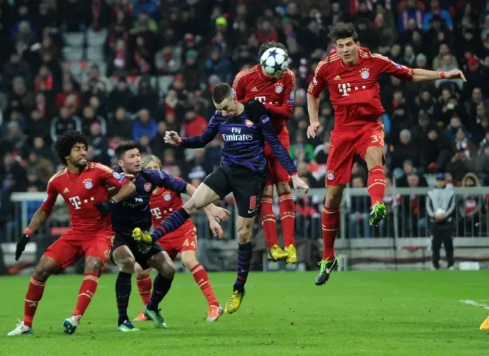 Framed Print : Laurent Koscielny's Headed Goal: Arsenal's Momentum Shift Against Bayern Munich in the 2012-13 UEFA Champions League