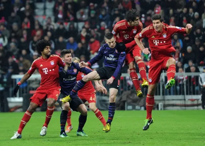 Framed Print : Laurent Koscielny's Header: Arsenal's Victory Moment Against Bayern Munich in the UEFA Champions League (2012-13)