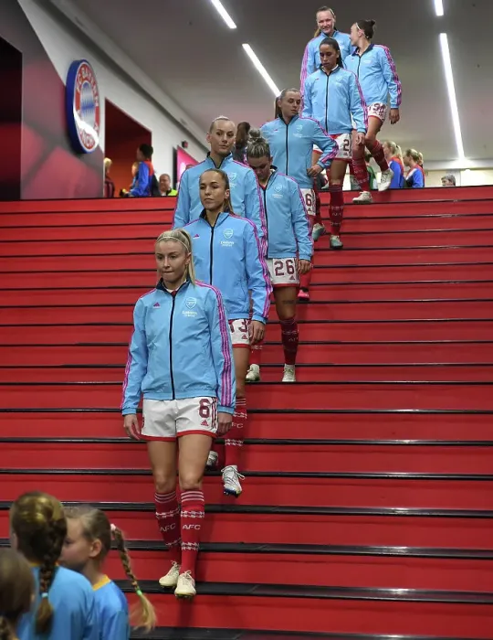 Framed Print : Leah Williamson's Determined Climb: Arsenal's Quarter-Final Battle at Allianz Arena against FC Bayern Munich, UEFA Women's Champions League 2022-23