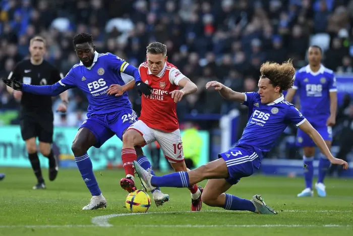 Framed Print : Leandro Trossard Faces Off Against Faes and Ndidi in Leicester City vs Arsenal Premier League Clash Framed Print : Leandro Trossard Faces Off Against Faes and Ndidi in Leicester City vs Arsenal Premier League Clash