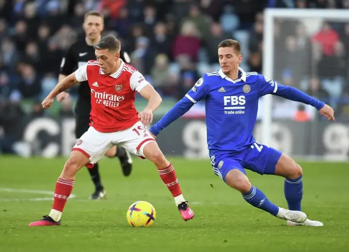 Framed Print : Leandro Trossard vs. Dennis Praet: Intense Battle in Leicester City vs. Arsenal FC Premier League Clash