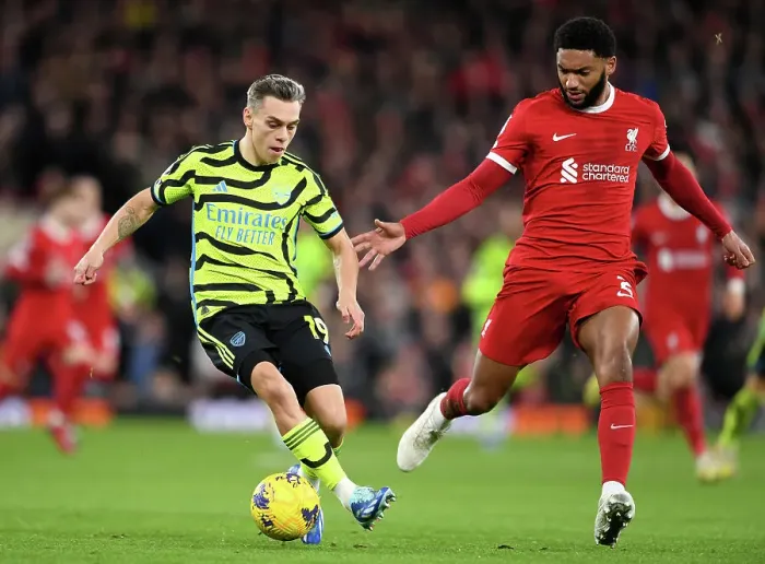 Framed Print : Leandro Trossard vs Joe Gomez: Intense Rivalry at Anfield - Premier League 2023-24
