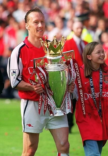 Lee Dixon holds the Premiership trophy after the match. Arsenal 4:3 Everton, F