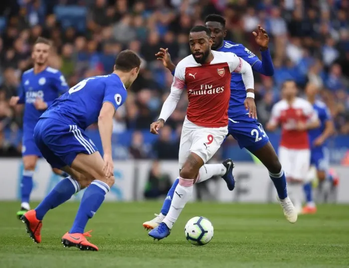 Framed Print : Leicester vs Arsenal: Lacazette Faces Off Against Evans and Ndidi