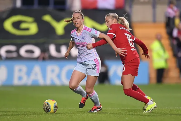 Framed Print : Lia Waelti vs. Sofie Lundgaard: Intense Battle in Liverpool FC vs. Arsenal FC Women's Super League Match