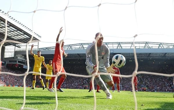 Liverpool goalkeeper Pepe Reina pushes the ball into his own net to score the Arsenal goal