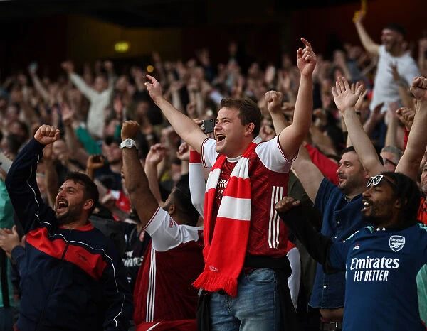London Derby: Arsenal vs. Tottenham - 2021-22 Premier League Clash: A Sea of Passionate Arsenal Supporters at Emirates Stadium