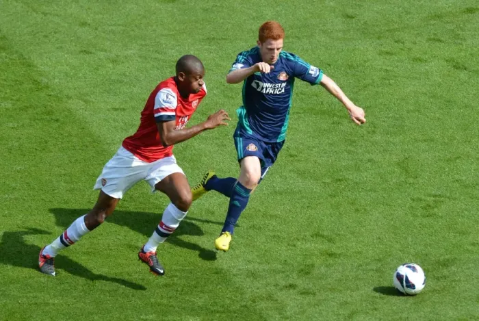 Framed Print : LONDON, ENGLAND - AUGUST 18: Abou Diaby of Arsenal takes on Jack Colback of Sunderland during the Barclays Premier League match between Arsenal and Sunderland at Emirates Stadium on August 18, 2012 in London, England. : Arsenal Football Framed Print : LONDON, ENGLAND - AUGUST 18: Abou Diaby of Arsenal takes on Jack Colback of Sunderland during the Barclays Premier League match between Arsenal and Sunderland at Emirates Stadium on August 18, 2012 in London, England. : Arsenal Football