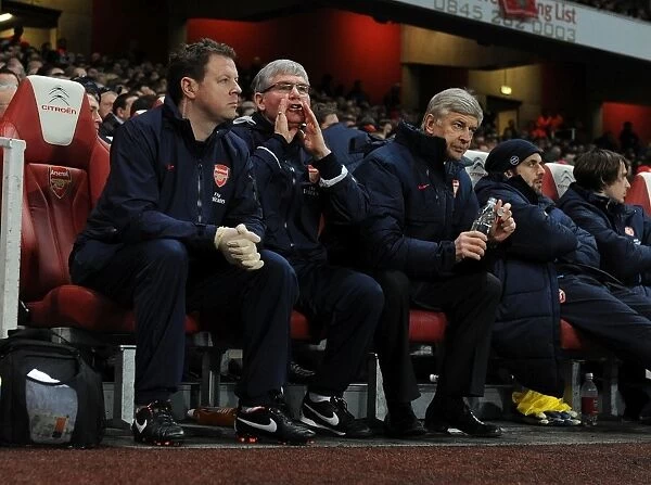 LONDON, ENGLAND - DECEMBER 26: R-L Arsenal manager Arsene Wenger, assistant Pat Rice