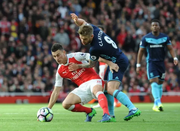 Framed Print : LONDON, ENGLAND - OCTOBER 22: Laurent Koscielny of Arsenal under pressure from Adam Clayton of Middlesbrough during Framed Print : LONDON, ENGLAND - OCTOBER 22: Laurent Koscielny of Arsenal under pressure from Adam Clayton of Middlesbrough during