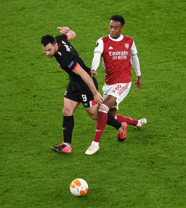 Framed Print : LONDON, ENGLAND - OCTOBER 29: Joe Willock of Arsenal challenges Patrick Hoban of Dundalk during the UEFA Europa League