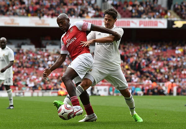 Luis Boa Morte Shines in Arsenal Legends vs Real Madrid Legends Clash: A Battle of Football Greats (2018-19)