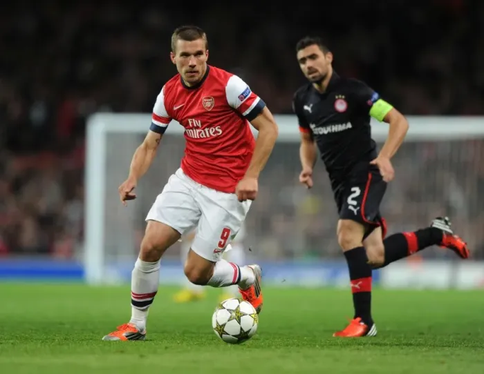Framed Print : Lukas Podolski in Action for Arsenal against Olympiacos, UEFA Champions League 2012-13