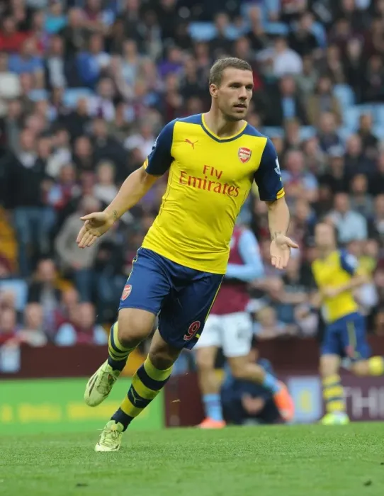Framed Print : Lukas Podolski in Action: Aston Villa vs. Arsenal, Premier League 2014-15
