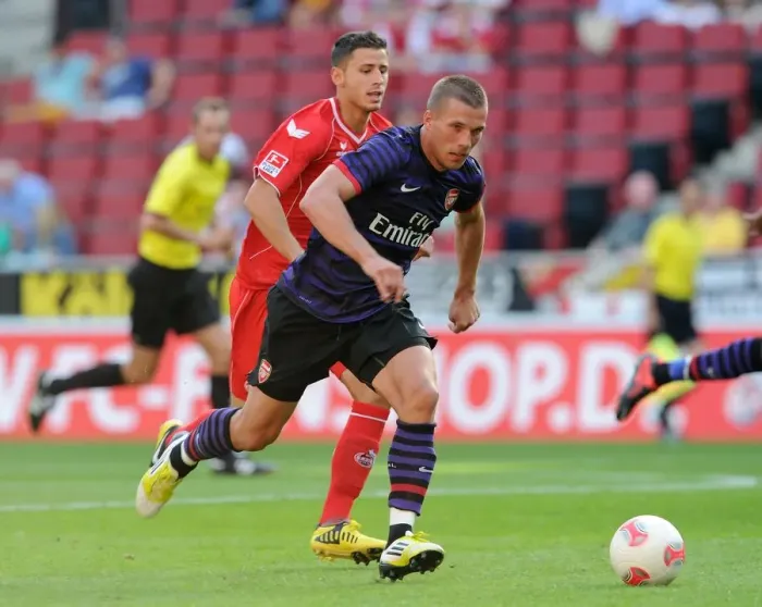 Framed Print : Lukas Podolski (Arsenal) Dino Bisanovic (Cologne). Cologne 0: 4 Arsenal