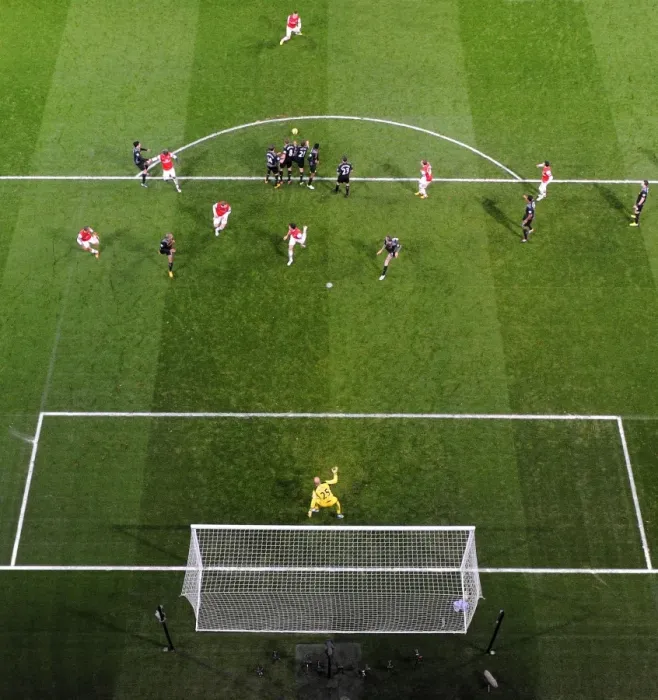 Framed Print : Lukas Podolski (Arsenal) free kick hits the Liverpool wall. Arsenal 2: 2 Liverpool