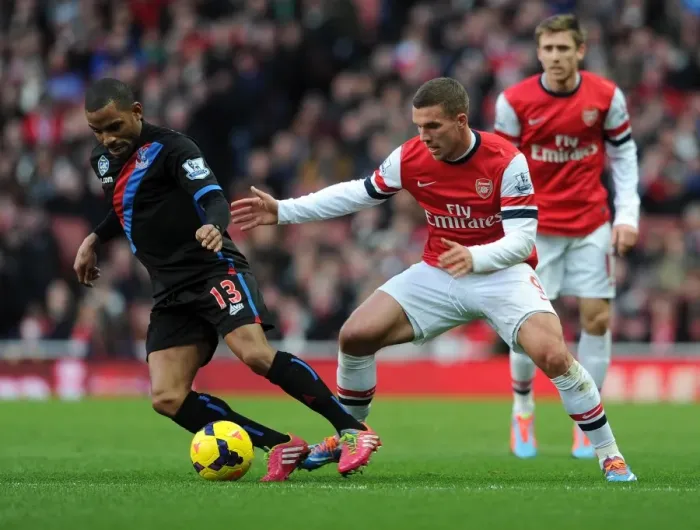 Framed Print : Lukas Podolski (Arsenal) Jason Puncheon (Palace). Arsenal 2: 0 Crystal Palace. Barclays
