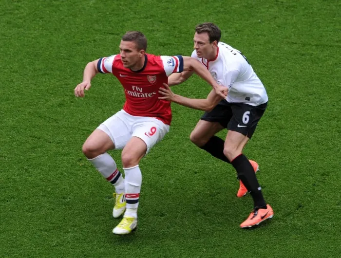 Framed Print : Lukas Podolski (Arsenal) Jonny Evans (Man Utd). Arsenal 1: 1 Manchester United. Barclays