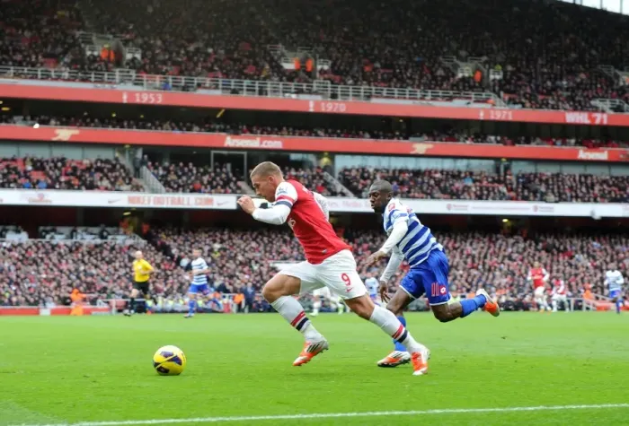 Framed Print : Lukas Podolski (Arsenal) Shaun Wright-Phillips (QPR). Arsenal 1: 0 Queens Park Rangers