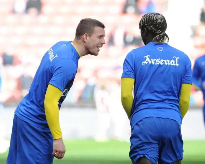 Framed Print : Lukas Podolski and Bacary Sagna (Arsenal). Stoke City 1: 0 Arsenal. Barclays Premier League
