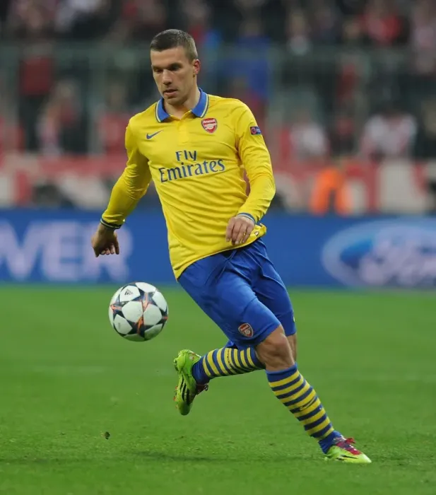 Framed Print : Lukas Podolski: Battle at the Allianz Arena - FC Bayern Munich vs Arsenal, UEFA Champions League 2014