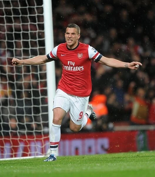 Lukas Podolski celebrates scoring his 2nd goal Arsenals 3rd. Arsenal 4:1 Wigan Athletic