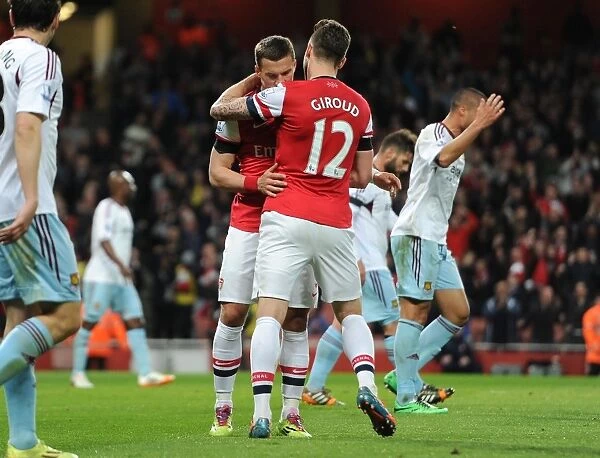 Lukas Podolski celebrates scoring his and Arsenals 1st goal with Olivier Giroud