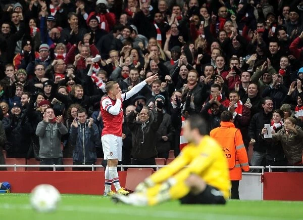Lukas Podolski celebrates scoring Arsenals 2nd goal. Arsenal 2:0 Montpellier. UEFA