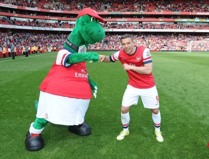 Framed Print : Lukas Podolski with Gunnersaurus: Arsenal vs. West Bromwich Albion, Premier League 2013-14 Framed Print : Lukas Podolski with Gunnersaurus: Arsenal vs. West Bromwich Albion, Premier League 2013-14