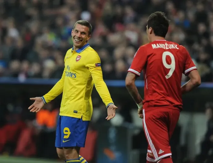 Framed Print : Lukas Podolski and Mario Mandzukic Share a Light-Hearted Moment Amidst UEFA Champions League Rivalry Framed Print : Lukas Podolski and Mario Mandzukic Share a Light-Hearted Moment Amidst UEFA Champions League Rivalry