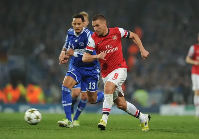 Framed Print : Lukas Podolski Outmaneuvers Jermaine Jones in Arsenal's UEFA Champions League Clash