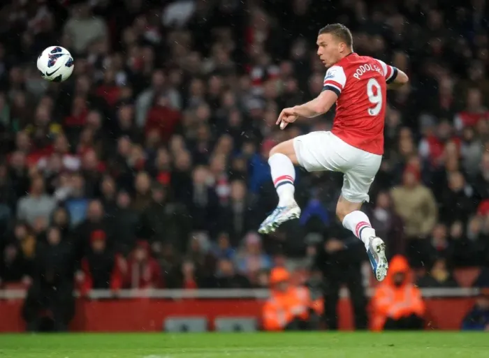 Framed Print : Lukas Podolski scores his 2nd goal Arsenals 3rd. Arsenal 4: 1 Wigan Athletic. Barclays Framed Print : Lukas Podolski scores his 2nd goal Arsenals 3rd. Arsenal 4: 1 Wigan Athletic. Barclays