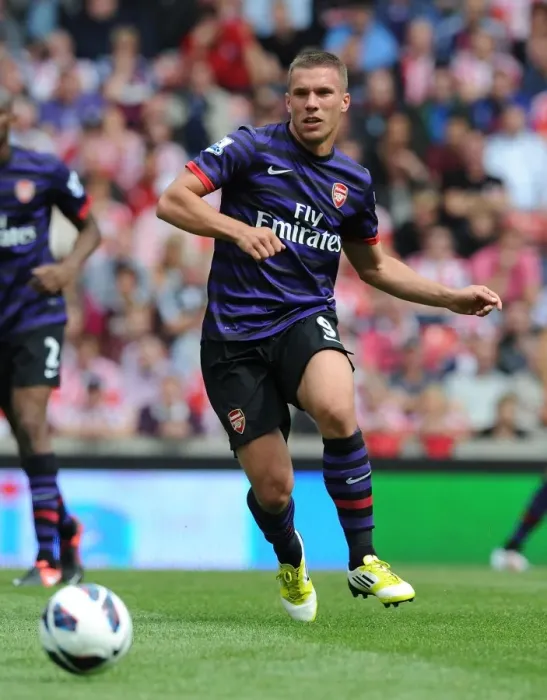 Framed Print : Lukas Podolski: Starring in Arsenal's Battle Against Stoke City, Premier League 2012-13