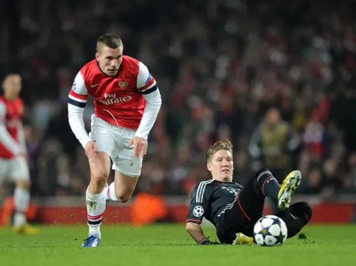 Framed Print : Lukas Podolski vs. Bastian Schweinsteiger: A Battle in the Arsenal v Bayern Munich UEFA Champions League Clash Framed Print : Lukas Podolski vs. Bastian Schweinsteiger: A Battle in the Arsenal v Bayern Munich UEFA Champions League Clash
