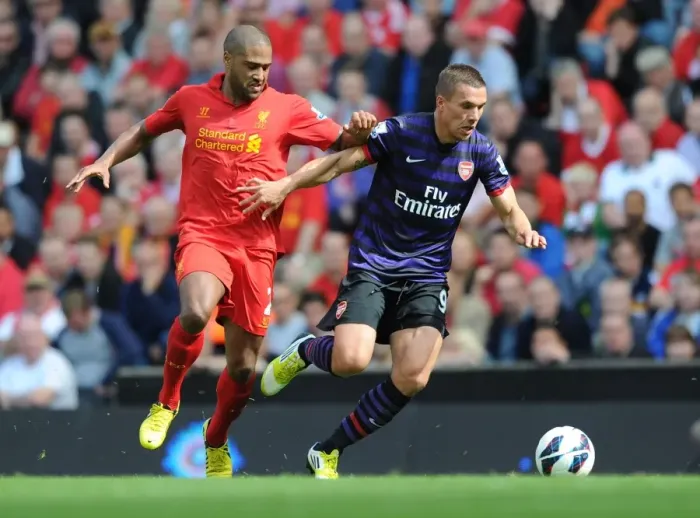 Framed Print : Lukas Podolski vs. Glen Johnson: Intense Battle at Anfield (Liverpool v Arsenal, 2012-13) Framed Print : Lukas Podolski vs. Glen Johnson: Intense Battle at Anfield (Liverpool v Arsenal, 2012-13)