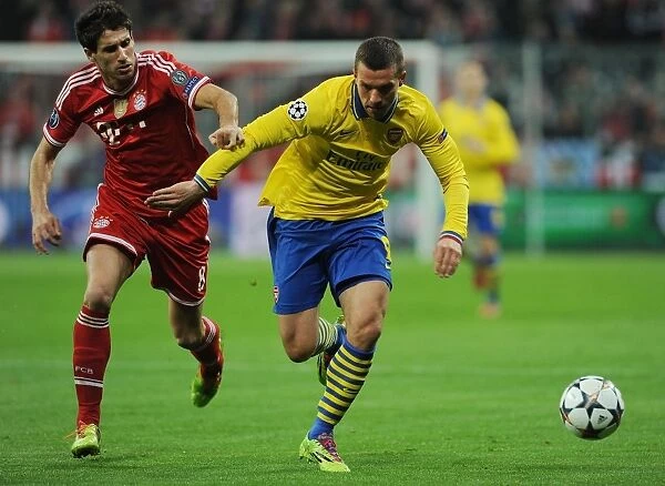 Lukas Podolski vs. Javi Martinez: Battle in the UEFA Champions League between FC Bayern Munich and Arsenal