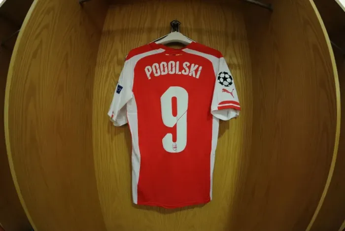 Framed Print : Lukas Podolski's Arsenal Shirt in the Changing Room Before Arsenal vs. Besiktas, UEFA Champions League Qualifiers (2014) Framed Print : Lukas Podolski's Arsenal Shirt in the Changing Room Before Arsenal vs. Besiktas, UEFA Champions League Qualifiers (2014)