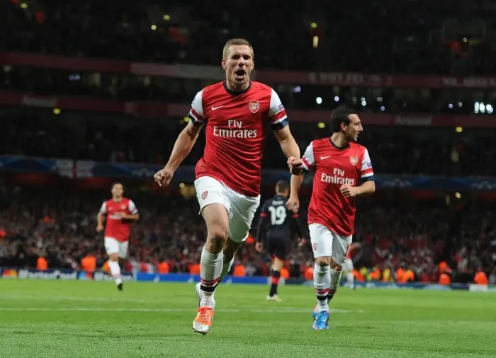 Framed Print : Lukas Podolski's Brace: Arsenal FC Triumphs Over Olympiacos FC in Champions League (2012)