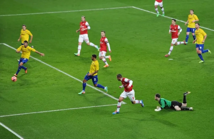 Framed Print : Lukas Podolski's Dramatic Goal: Arsenal's FA Cup Victory Over Coventry City (2014) - Outmaneuvering Joe Murphy
