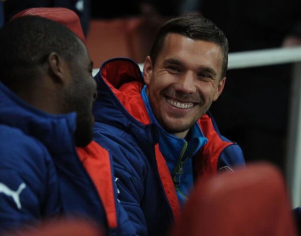 Lukas Podolski's Emotional Reunion: Arsenal vs. Borussia Dortmund in the UEFA Champions League 2014-15