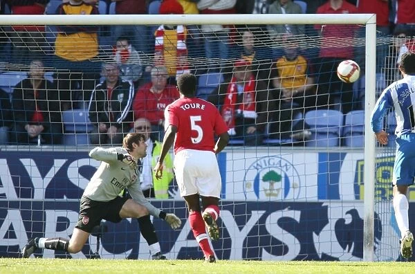 Lukasz Fabianski (Arsenal) watches Ben Watsons free kick hit the post