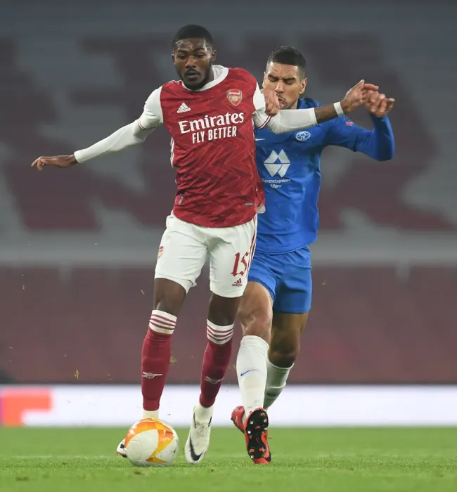 Framed Print : Maitland-Niles Outsmarts Omoijuanfo: Arsenal's Pivotal Moment in Europa League Victory