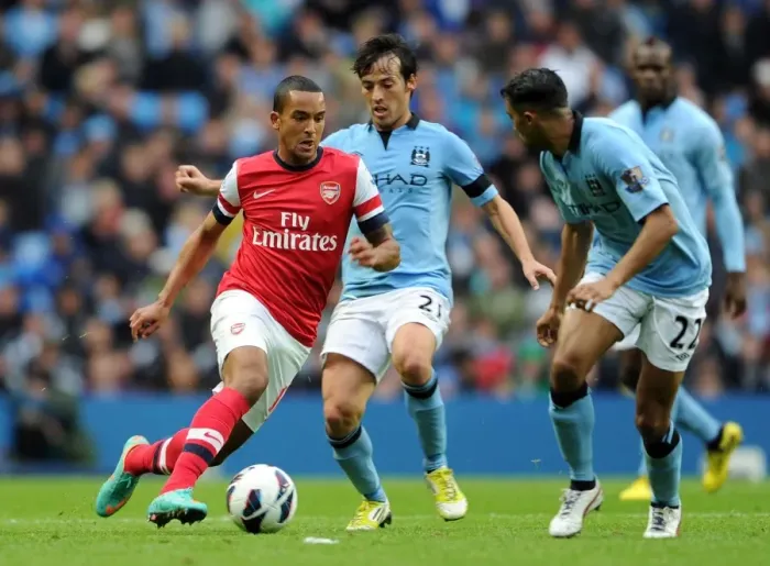 Framed Print : Manchester City vs Arsenal: Walcott vs Silva - Premier League's Intense Rivalry (1-1)