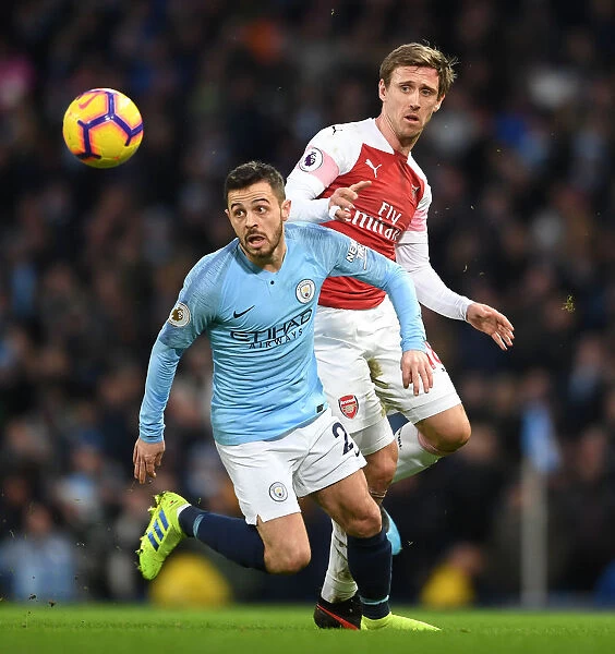 Manchester City's Bernardo Silva Closes In on Arsenal's Nacho Monreal: Intense Pressure at Etihad Stadium, Premier League 2018-19